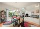 Light-filled dining area features a glass table and access to an outdoor space, perfect for Gathering meals at 5428 Colonial Garden Dr, Huntersville, NC 28078