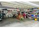 Spacious two-car garage with overhead storage and shelving provides ample storage for vehicles and equipment at 5428 Colonial Garden Dr, Huntersville, NC 28078
