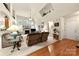 Spacious living room with high ceilings, a fireplace, and carpeted floors, perfect for relaxation at 5428 Colonial Garden Dr, Huntersville, NC 28078