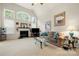 Bright living room featuring vaulted ceilings, a cozy fireplace, and large windows for a welcoming atmosphere at 5428 Colonial Garden Dr, Huntersville, NC 28078