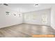 Bright and airy living room with neutral walls and multiple windows at 6009 Jasmine Branch Rd, Charlotte, NC 28216