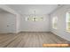 Spacious living room featuring luxury vinyl plank flooring and recessed lighting at 6009 Jasmine Branch Rd, Charlotte, NC 28216