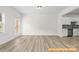 Inviting living room with modern flooring and plenty of natural light at 6009 Jasmine Branch Rd, Charlotte, NC 28216