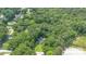 Aerial view of a home nestled among lush trees, offering privacy and a serene setting at 611 W Robinson St, Dallas, NC 28034