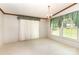 Sunny dining room with large windows dressed in patterned valances and neutral flooring at 611 W Robinson St, Dallas, NC 28034