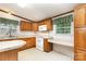 The bright kitchen offers wood cabinetry, modern appliances, and ample counter space, creating an efficient cooking environment at 611 W Robinson St, Dallas, NC 28034
