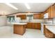 The kitchen features oak cabinets, an island, and plenty of counter space for meal preparation at 611 W Robinson St, Dallas, NC 28034
