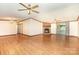 A spacious living room features a stone fireplace and laminate flooring with abundant space for entertaining at 611 W Robinson St, Dallas, NC 28034