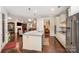Bright, open kitchen featuring an island, modern appliances, and seamless flow to the living area at 8737 Mullis Forest Ct, Mint Hill, NC 28227