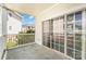 Balcony view showcases adjacent buildings, greenery, and a sliding glass door at 8969 Meadow Vista Rd, Charlotte, NC 28213