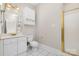 Bathroom featuring bright, white cabinets, shower stall, and white tile floors at 8969 Meadow Vista Rd, Charlotte, NC 28213