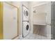 Bathroom with shower and stackable washer dryer unit, convenient and space-saving at 8969 Meadow Vista Rd, Charlotte, NC 28213