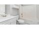 Bright bathroom with a shower-tub combo, vanity, and convenient toilet at 8969 Meadow Vista Rd, Charlotte, NC 28213