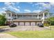 Apartment building with garage parking and classic architectural details offers a convenient lifestyle at 8969 Meadow Vista Rd, Charlotte, NC 28213