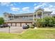 Attractive condo building with multiple levels, garage parking, and well-maintained landscaping at 8969 Meadow Vista Rd, Charlotte, NC 28213