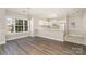 Open floor plan with kitchen, hardwood style floors, and plenty of natural light at 8969 Meadow Vista Rd, Charlotte, NC 28213
