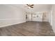 Open-concept living space with hardwood floors, connecting to the kitchen area at 8969 Meadow Vista Rd, Charlotte, NC 28213