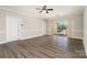 Spacious living room with hardwood floors and sliding glass doors to a balcony at 8969 Meadow Vista Rd, Charlotte, NC 28213