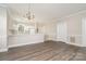 Hardwood-style floors and neutral paint, leading to the kitchen and other living areas at 8969 Meadow Vista Rd, Charlotte, NC 28213