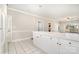 Spacious living area with bar counter between kitchen and open floor plan at 8969 Meadow Vista Rd, Charlotte, NC 28213