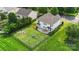 Aerial view of a large, private backyard with a patio, fire pit, and play area at 9008 Magna Ln, Indian Trail, NC 28079