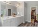 Bathroom features double sinks, tile flooring and access to a walk in closet at 9008 Magna Ln, Indian Trail, NC 28079