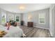 Spacious bedroom features neutral walls and floors, along with large windows at 9008 Magna Ln, Indian Trail, NC 28079
