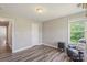 Cozy bedroom with modern flooring, natural light, and a convenient doorway and closet at 9008 Magna Ln, Indian Trail, NC 28079