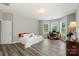 Large bedroom with wood-look floors, natural light and a spacious design at 9008 Magna Ln, Indian Trail, NC 28079