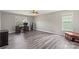 Spacious bedroom featuring luxury vinyl plank flooring, two windows, and an elegant ceiling fan at 9008 Magna Ln, Indian Trail, NC 28079