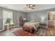 Charming bedroom featuring a cozy bed, and a window for natural light at 9008 Magna Ln, Indian Trail, NC 28079