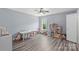 Spacious bonus room with wood floors, toys, and a view of the backyard at 9008 Magna Ln, Indian Trail, NC 28079