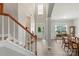 Grand foyer with staircase leading to the upper level and view into dining room at 9008 Magna Ln, Indian Trail, NC 28079