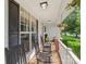 Cozy front porch with rocking chairs, perfect for relaxing and enjoying the neighborhood at 9008 Magna Ln, Indian Trail, NC 28079