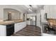 Bright kitchen features white cabinets, stainless steel appliances and dark countertops at 9008 Magna Ln, Indian Trail, NC 28079