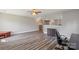 Open living space with modern flooring and neutral walls, offering a versatile layout for entertaining at 9008 Magna Ln, Indian Trail, NC 28079