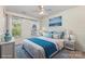 This bedroom features a blue and white color scheme with two windows and bedside tables at 9107 Royal Highlands Ct, Charlotte, NC 28277