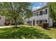 Well-maintained home with large lawn and mature shade trees, offering a serene and inviting outdoor space at 9107 Royal Highlands Ct, Charlotte, NC 28277