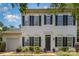 Charming two-story home with black shutters and a well-maintained front yard, providing excellent curb appeal at 9107 Royal Highlands Ct, Charlotte, NC 28277