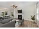 Stylish living room with fireplace, hardwood floors, and comfortable seating, ideal for entertaining or relaxing at 9107 Royal Highlands Ct, Charlotte, NC 28277