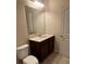 Bathroom featuring vanity, sink, mirror, and commode at 9593 Camberley Nw Ave, Concord, NC 28027