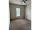 Bedroom with a ceiling fan, neutral walls, plush carpet and window at 9593 Camberley Nw Ave, Concord, NC 28027