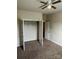 Bedroom with closet, carpeted floors, and doorway at 9593 Camberley Nw Ave, Concord, NC 28027