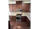 Well-equipped kitchen with stainless steel stove, microwave, granite countertops, and backsplash at 9593 Camberley Nw Ave, Concord, NC 28027