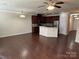 Modern kitchen with stainless steel appliances, granite countertops, and dark wood cabinets at 9593 Camberley Nw Ave, Concord, NC 28027