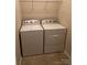 Functional laundry room with washer and dryer hookups for easy chore management at 9593 Camberley Nw Ave, Concord, NC 28027