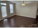 Bright living room with hardwood floors, access to patio, and neutral color scheme at 9593 Camberley Nw Ave, Concord, NC 28027