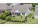Aerial view of the property highlighting the home, landscaped backyard, and neighborhood at 10016 St Kitts Landing Ln, Charlotte, NC 28278
