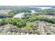 Stunning aerial view of the neighborhood with lake and lush green forest at 10016 St Kitts Landing Ln, Charlotte, NC 28278