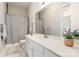 Bright bathroom with white cabinets, modern fixtures, and a stylish patterned shower curtain at 10016 St Kitts Landing Ln, Charlotte, NC 28278